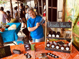 Shelley Burich founder of Vaoala Vanilla happily displaying her vanilla products at the local organic farmers market in Samoa